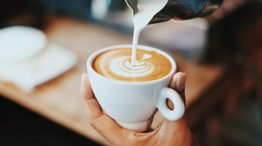 How to Make Lattes and person making latte art