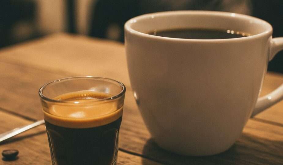 Espresso shot next to a mug of filter coffee